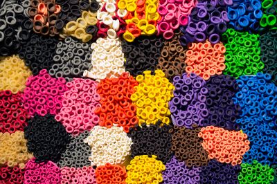 Pattern of colorful latex balloon nozzles organized by colors as seen from overhead